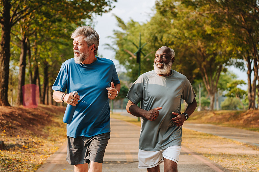 Two Men Exercising Outside by Going for Jog