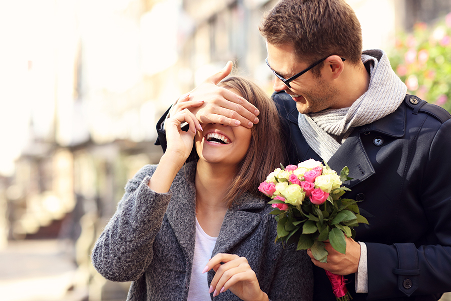 Man Giving a Woman Flowers on Valentine's Day
